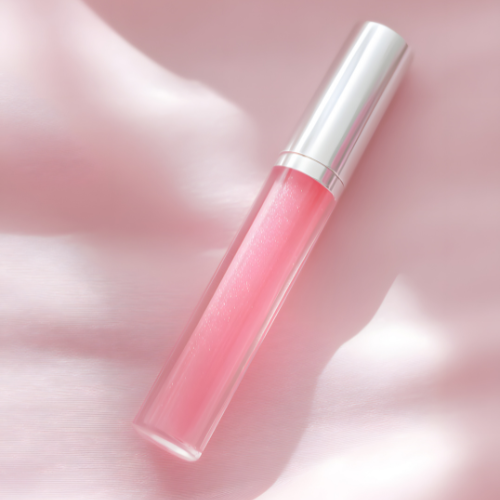 Applying Rare Beauty Lip Oil for glossy, hydrated lips