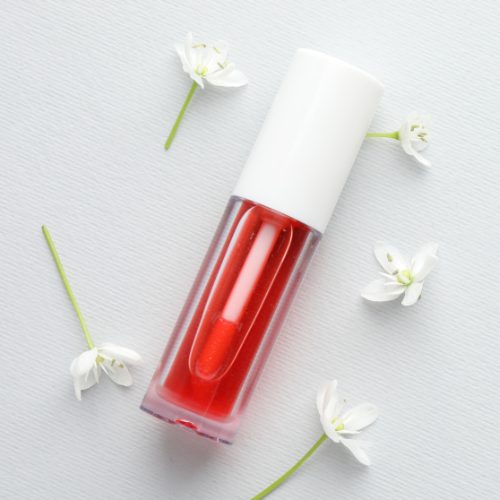 Ingredients of Rare Beauty Lip Oil showing nourishing oils and vitamins