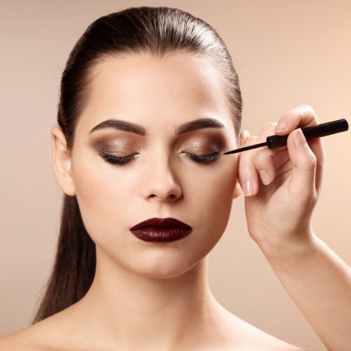 Applying waterproof eyeliner for long wear